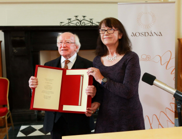 President Micheal D. Higgins with Eilis ni Dhuibhne; writer and member of Toscaireacht (steering committee of Aosdana) as she presented him with a book by Samuel Beckett.