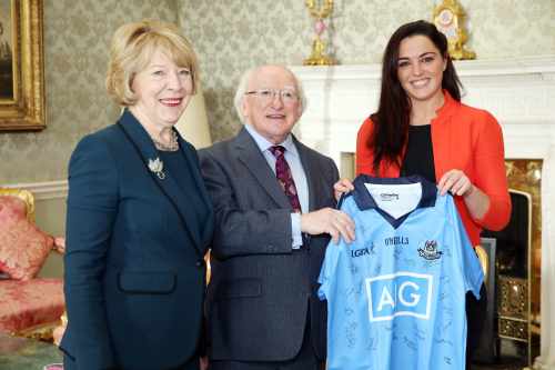 Pic shows Dublin ladies Gaelic Football captain  Sinead Goldrick as she presents a signed Dublin jersey to the president and his wife Sabina at the reception.Pic Maxwells