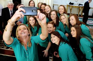 Pic shows  Kate Dillon a member of the Irish Hockey Team as she takes a group photo of herself and team mates in the the Aras during the reception.Pic Maxwells