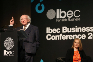 President Michael D. Higgins addressing the audience and conference chairn, Claire Byrne