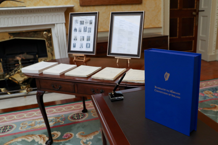 President signs text of Bunreacht na hÉireann in accordance with Article 25 of the Constitution
