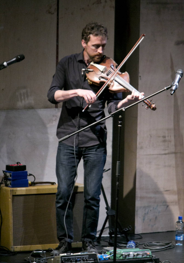 Colm Mac Con Iomaire performs at the launch of the Handbook of the Irish Revival