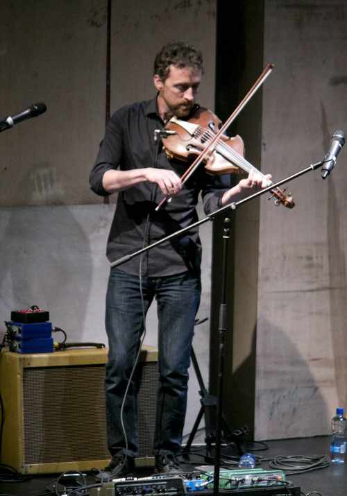 Colm Mac Con Iomaire performs at the launch of the Handbook of the Irish Revival