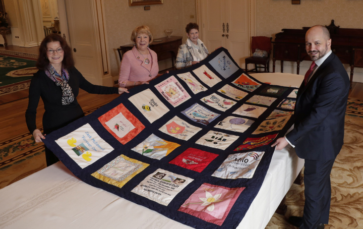 Sabina participates in photo shoot for unveiling of FirstLight’s Remembrance Patchwork Quilt. 