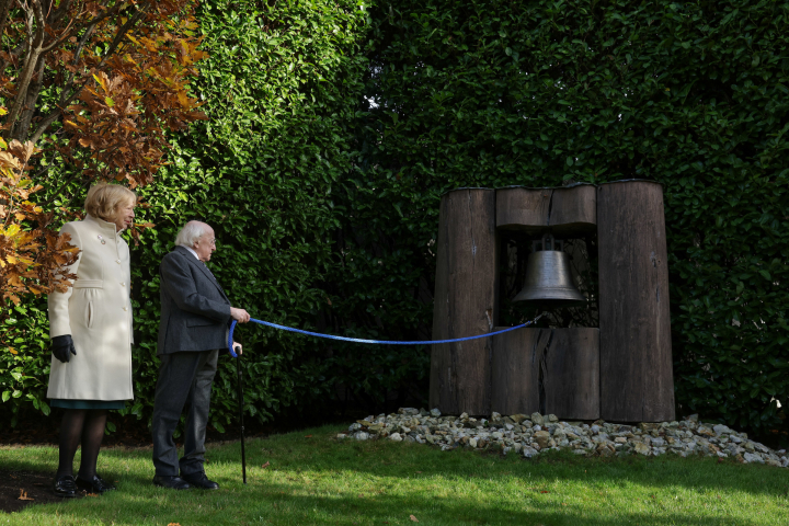 President and Sabina ring the Peace Bell as part of Bells for Peace Ireland