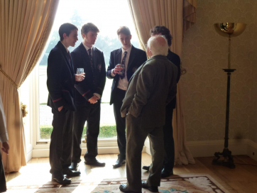 George Stokes, Matthew Wilson, Joshua Hobson and Connor Chambers have a yarn with President Higgins