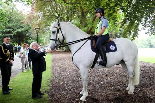 President Micheal D.Higgins meeting Garda Orla Crowe and the horse Fiachra.