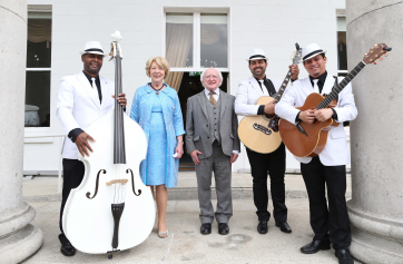 The Havana Club Trio  Ronald Pino,Tony Oscar and Benjamin Becerra posing for a photo with President Higgins and Mrs Higgins