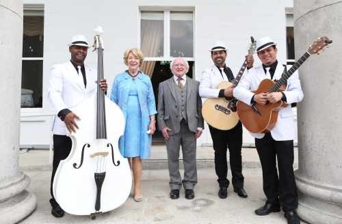 The Havana Club Trio  Ronald Pino,Tony Oscar and Benjamin Becerra posing for a photo with President Higgins and Mrs Higgins
