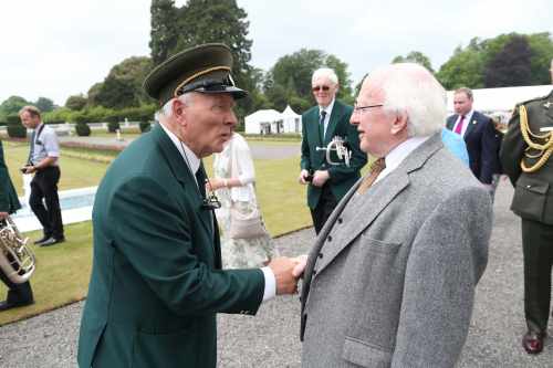 President  Higgins greeting band members from St Patricks Brass band in Galway in the gardens at the Aras.