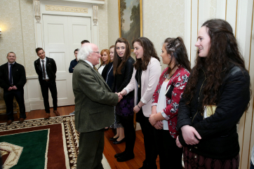 President Michael D.Higgins shaking hands with Catriona Casey, member of the Handball Ireland team.
