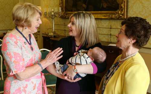 Sabina Higgins chats to Cliodhna Gallagher with her 3 week-old son, Bobby, and mother, Mary Barlow, from Clontarf, Dublin