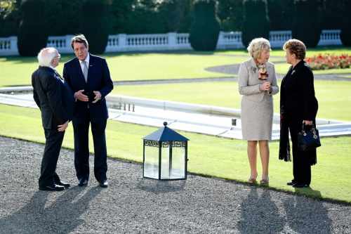 H.E. Mr. Nicos Anastasiades, President of the Republic of Cyprus, President Michael D. Higgins, Andri Anastasiades and Sabina Higgins in the grounds of Aras after tree planting.