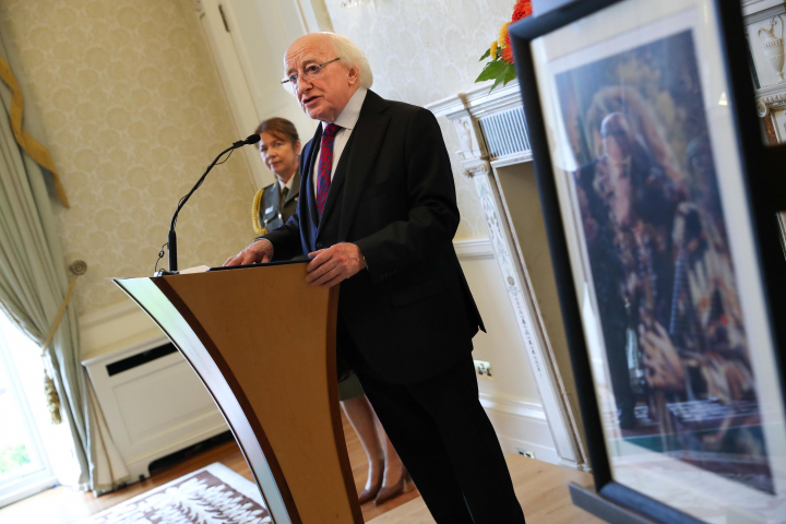 President receives a commemorative silver ‘Rory Gallagher’ coin commissioned by Central Bank
