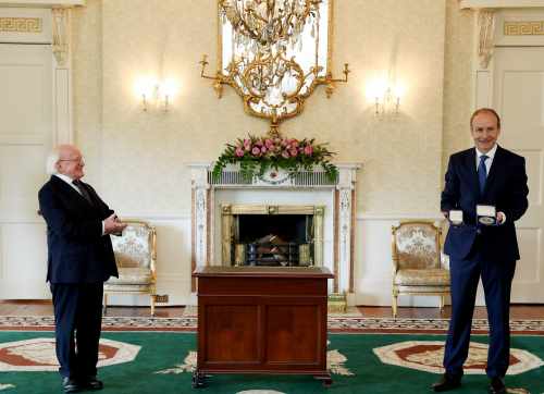 President Higgins presents Taoiseach Martin with Seal of Office