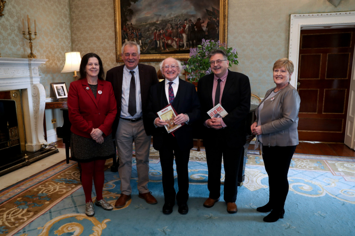 President receives Director of Limerick Writers Centre Dominic Taylor who presents their publication on the Limerick Soviet Centenary