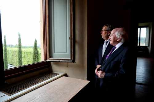 President Higgins as he arrives at the European University Institute in Florence Italy looking out over the city of Florence with Professor Renaud Dehousse President EUI
