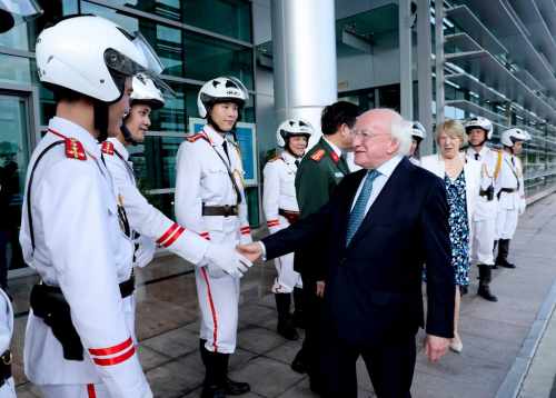 President Michael D. Higgins and his wife Sabina depart Hanoi thanking the motorcycle outriders before traveling to Laos