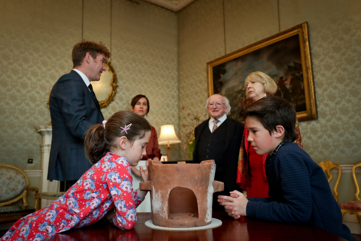 President receives Mr. Conor Fox who presents an Alfred Chisale stove from Malawi