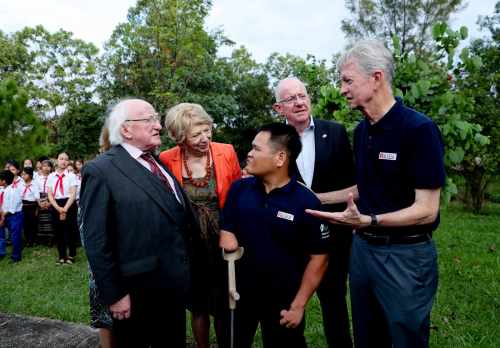 President Higgins, Sabina, Minister for Foreign Affairs and Trade Charlie Flanagan as they meet with Chuck Searcy International Advisor and Survivor Mr Thi