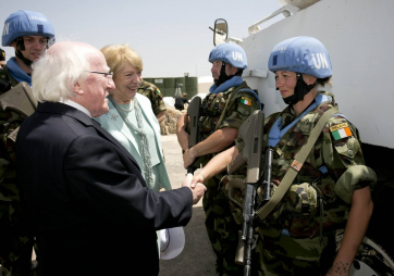 President Michael D Higgins and his wife Sabina's meeting Trooper Niamh Sheehan from Cork , a member of the 47th Infantry Group