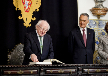 Pictured is President Michael D Higgins signing the visitor book at Belem Palace in Lisbon with President of Portugal, Cavaco Silva