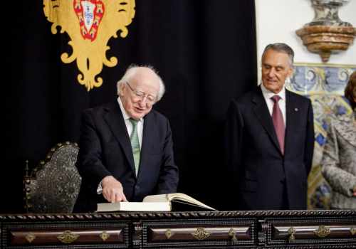 Pictured is President Michael D Higgins signing the visitor book at Belem Palace in Lisbon with President of Portugal, Cavaco Silva