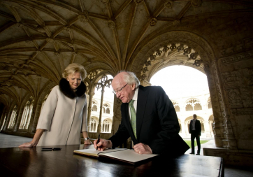 President Michael D Higgins with Isabel Cruz de Almeida, Director, Monastery of Jeronimos signing the visitors book in the Cloisters of the Monastery of Jeronimos