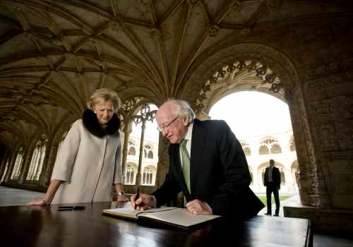 President Michael D Higgins with Isabel Cruz de Almeida, Director, Monastery of Jeronimos signing the visitors book in the Cloisters of the Monastery of Jeronimos