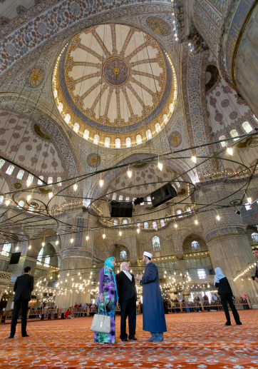 Pictured is President Michael D Higgins and his wife Sabina with Imam Istak Kizilaslan during a visit to the Blue Mosque in Istanbul