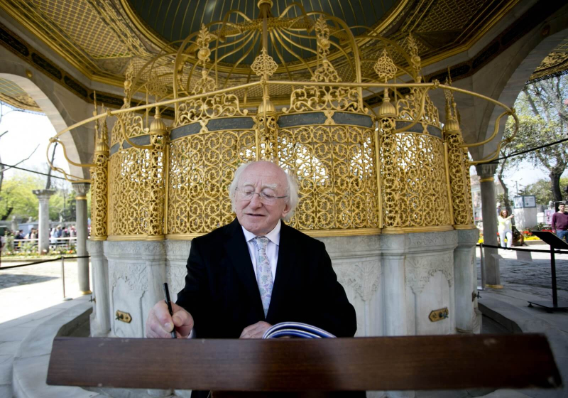 Pictured is President Michael D Higgins signs the visitors book at the Hagia Sofia in Istanbul