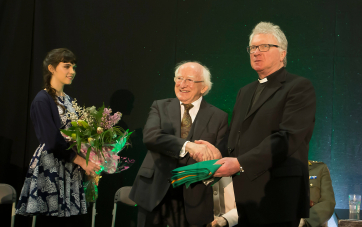 Pictured is President Higgins presented with the Irish Flag from chairperson of the Thomas F Meagher Foundation, Revd Cavanagh. Picture: Patrick Browne