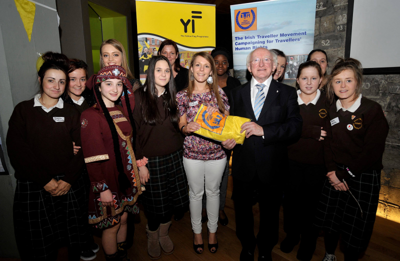 Students from Margaret Aylward CC and teacher Emily Dunleavy receiving the Yellow Flag Award from Michael D. Higgins and Diana Bunici. Picture Tommy Clancy