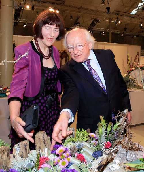 President Michael D. Higgins is shown a Coastal Narrative creation by Brid Kelleher, Chair of the show.