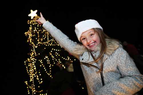 Luana Horan (9) as she points to the top of the tree after the President had switched on the Christmas tree lights